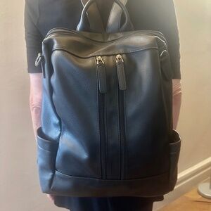 Versitle many compartment laptop backpack/purse/carryall